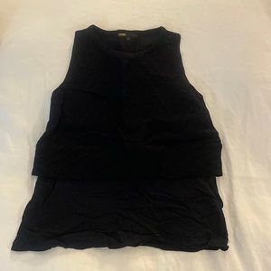 Great condition over layered black blouse. Has a cute zipper in the back.